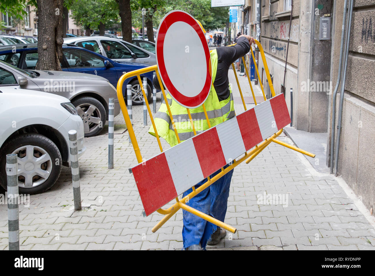 Carrying Sign Man at work road sign hi-res stock photography and images - Alamy