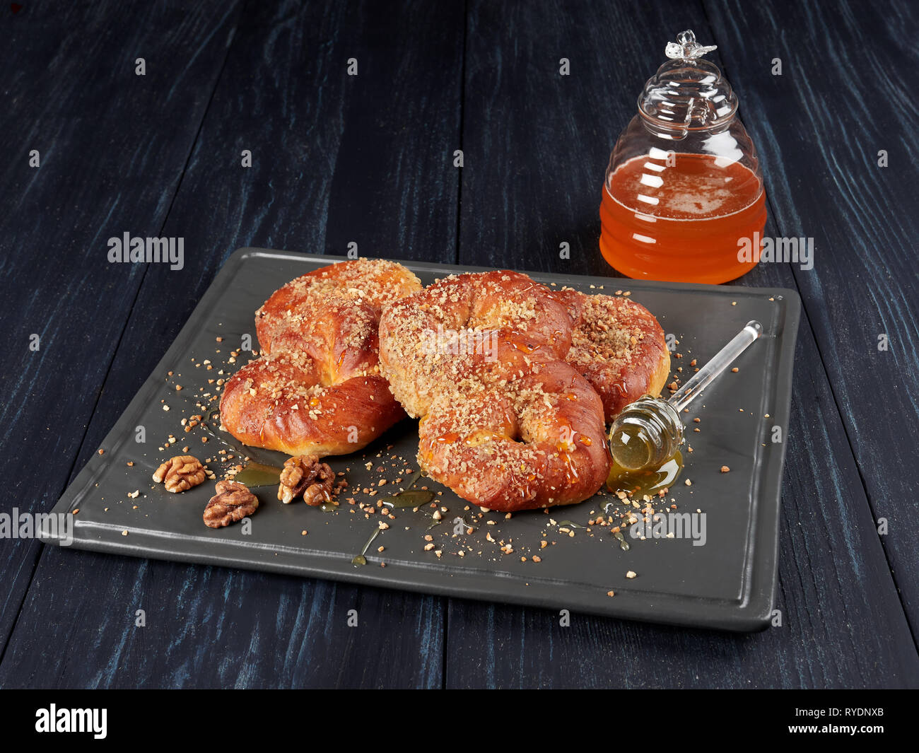 Romanian mucenici from Moldeova region: figure eight shaped pasta, boiled in water with sugar, cinnamon and crushed nuts. Traditional dessert for the  Stock Photo