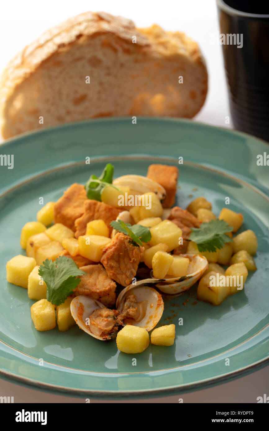 carne de porco alentejana, pork meat, clams fried potatoes and special