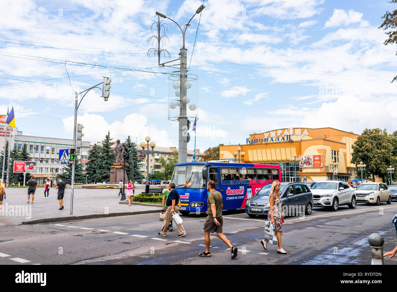 Rivne, Ukraine - August 16, 2018: Main square street with Rovno old architecture city in western Ukraine and outdoor park in summer people crossing ro Stock Photo