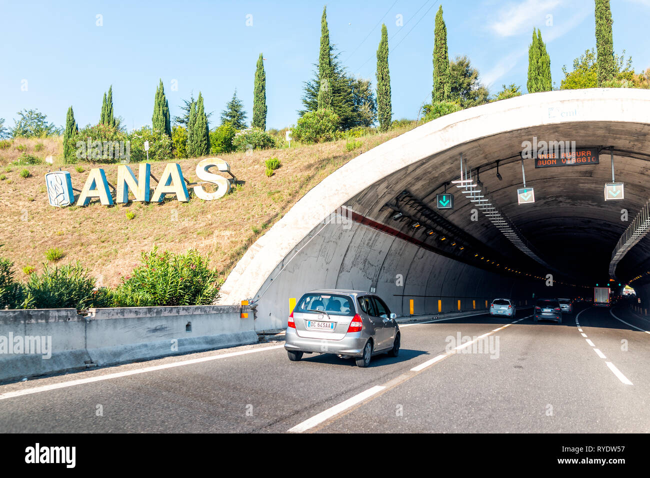 Rome, Italy - August 24, 2018: Sunny summer day and highway road street with ANAS sign and tunnel on modern autostrade Stock Photo