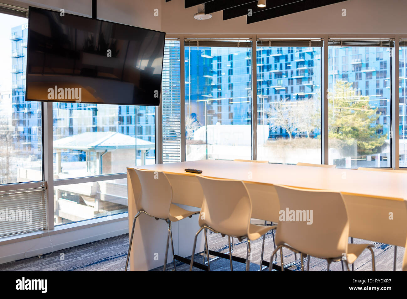 Modern office in building with wooden meeting corporate business table