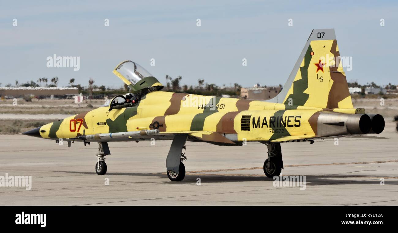 A Marine Corps F-5 Tiger fighter jet taxiing on a runway at MCAS Yuma. Stock Photo