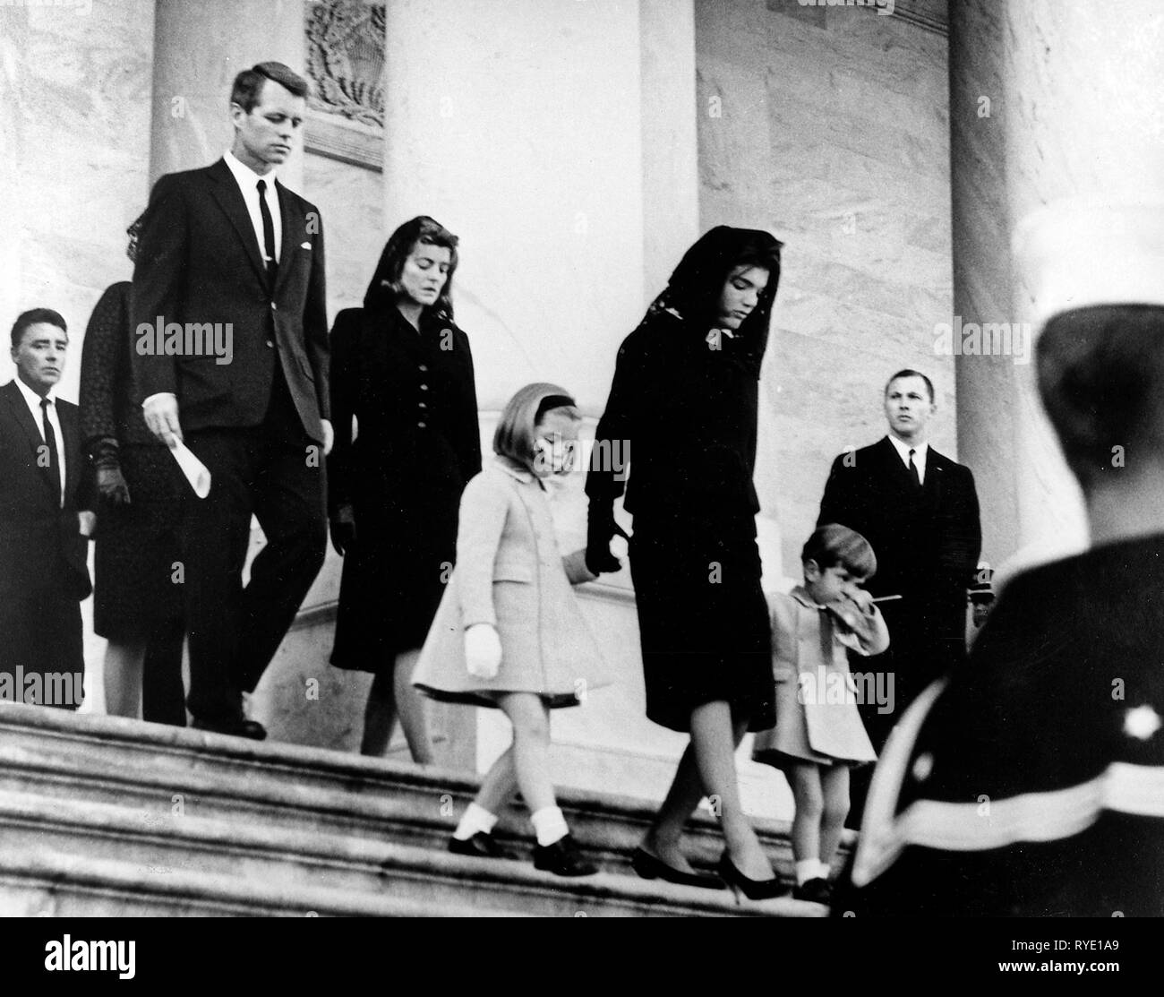 President's Family leaves Capitol after Ceremony. Caroline Kennedy, Jacqueline Bouvier Kennedy, John F. Kennedy, Jr. (2nd row) Attorney General Robert F. Kennedy, Patricia Kennedy Lawford (hidden) Jean Kennedy Smith (3rd Row) Peter Lawford. United States Capitol, East Front, Washington, D.C. Stock Photo
