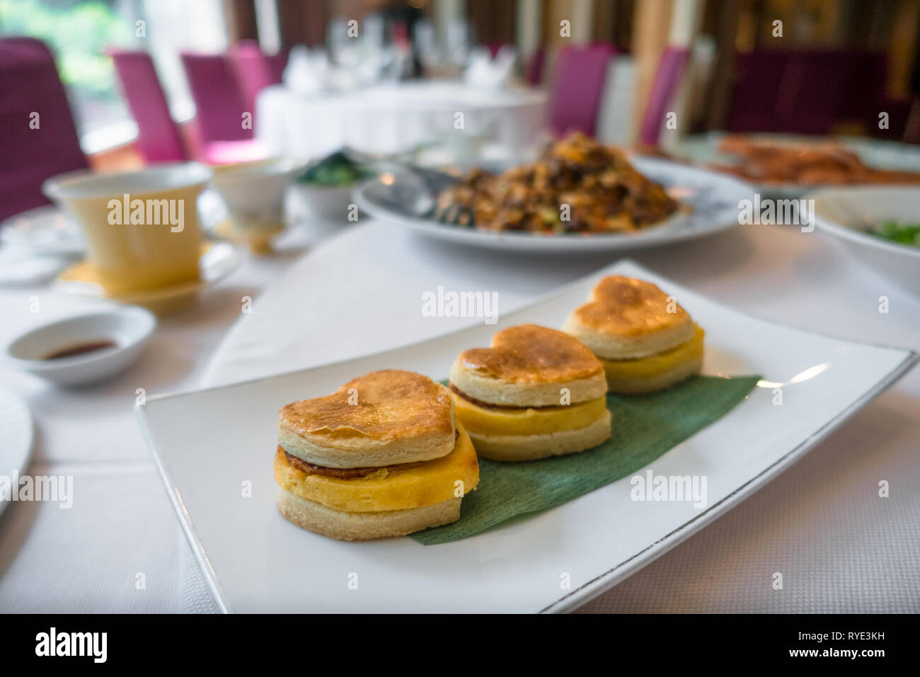 Heart shaped dessert pastries on plate at CHIOU-HWA restaurant - Taipei, Taiwan Stock Photo