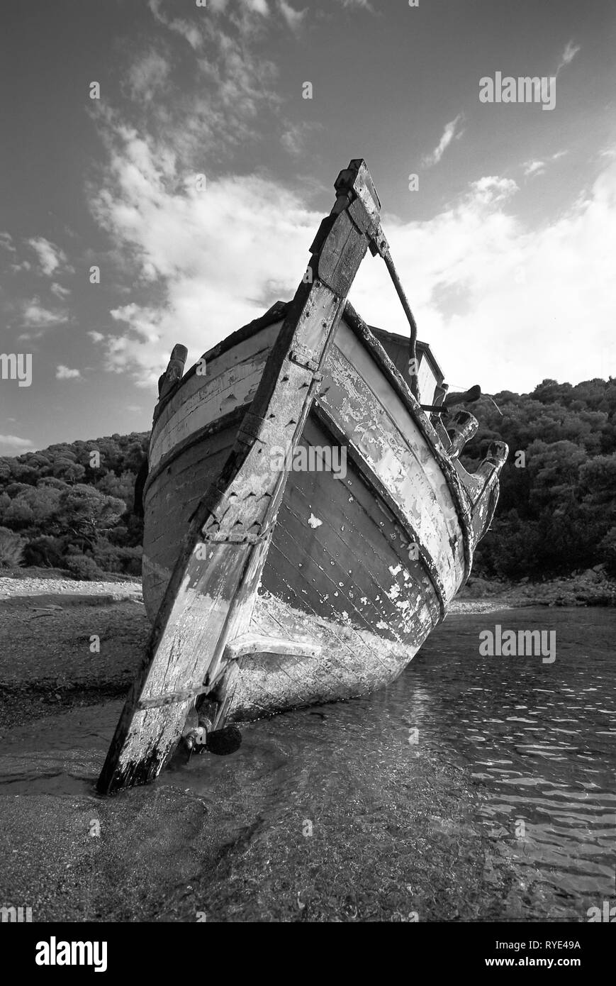 Traditional wooden boat shipwreck at the beach Agalipa of Skyros island, in Sporades complex, central Greece, Aegean sea , Mediterranean, Europe. Stock Photo