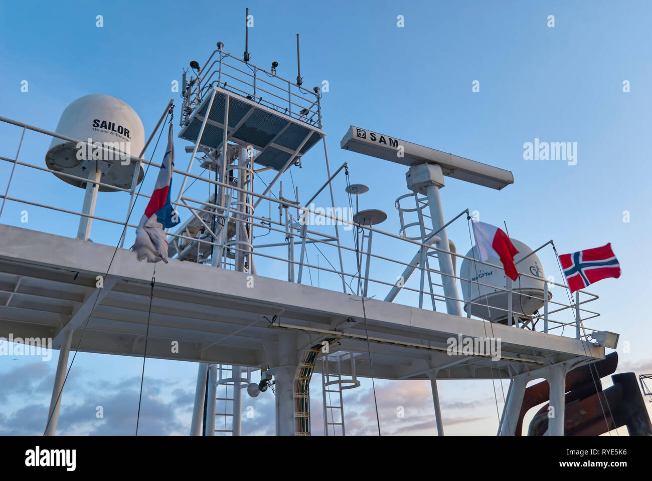 Looking up at the equipment on the Monkey Island and Superstructure of a Seismic Vessel as it transits into Bergen. Norway. Stock Photo