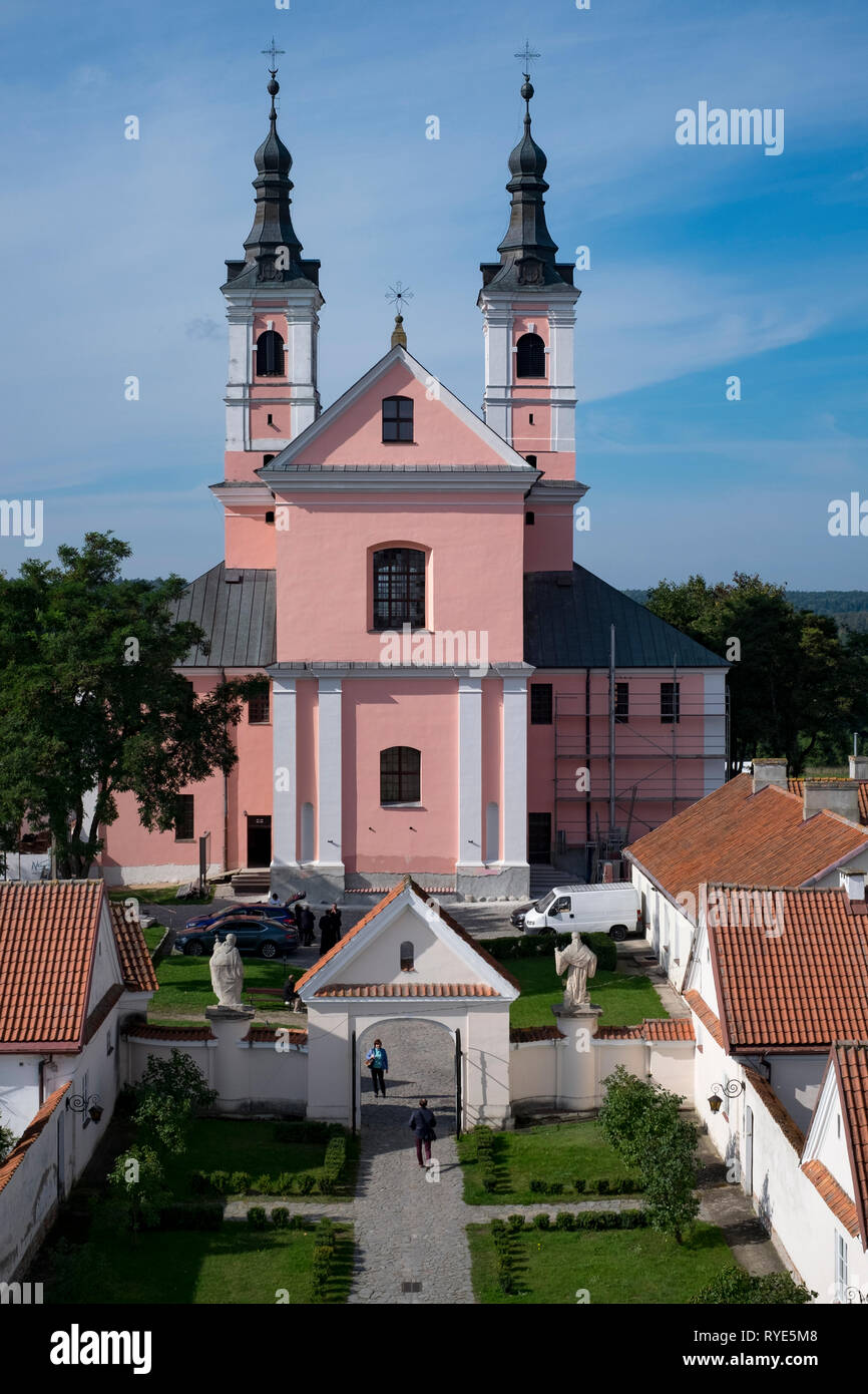 Catholic church with twin steeples attached to a monastic compound in