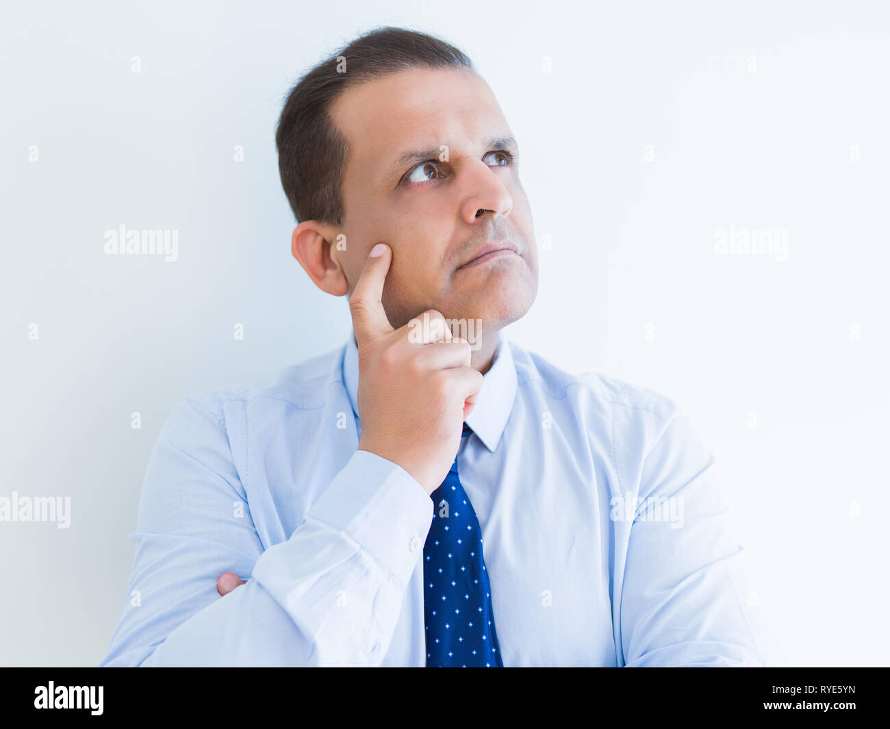 Middle age man thinking clueless about a question Stock Photo