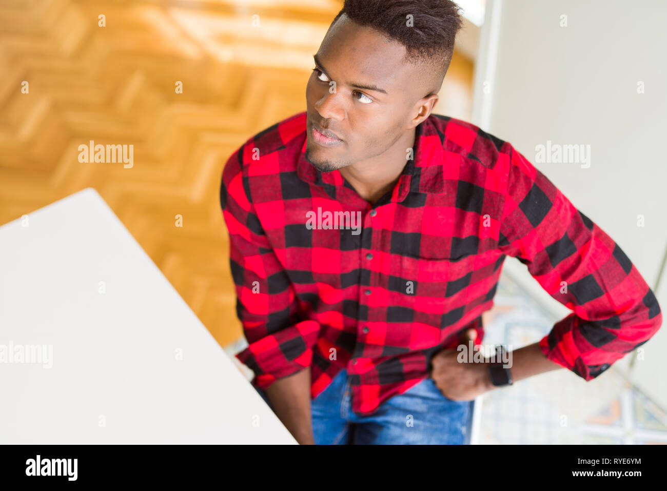 Overhead angle of handsome african american man looking to side, relax
