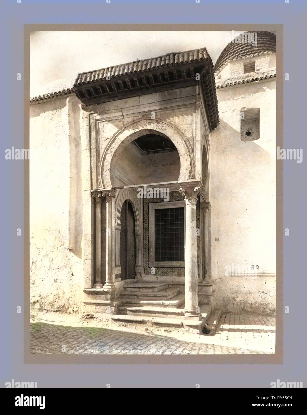 Tunis Gate College, Tunisia, the Neurdein Photographs of Algeria Including Byzantine and Roman Ruins in Tébessa and Thamugadi, Mosques, Shrines, Public Buildings, Palaces, and Street Scenes in Mostaganem, Biskra, Algiers, Tlemcen, Constantine, Oran, and Sidi Bel Abbès, and the Cathedral at Carthage. Portraits of Algerian People Include Berbers, Ouled Naïl Women, and Prisoners in Annaba. Tunisian Views Include Mosques, Buildings, and Street Scenes in Tunis Stock Photo