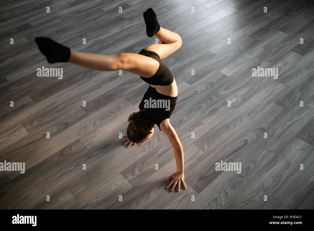 Sport, training, stretching, dancing active lifestyle concept. Young girl practicing dance Stock Photo