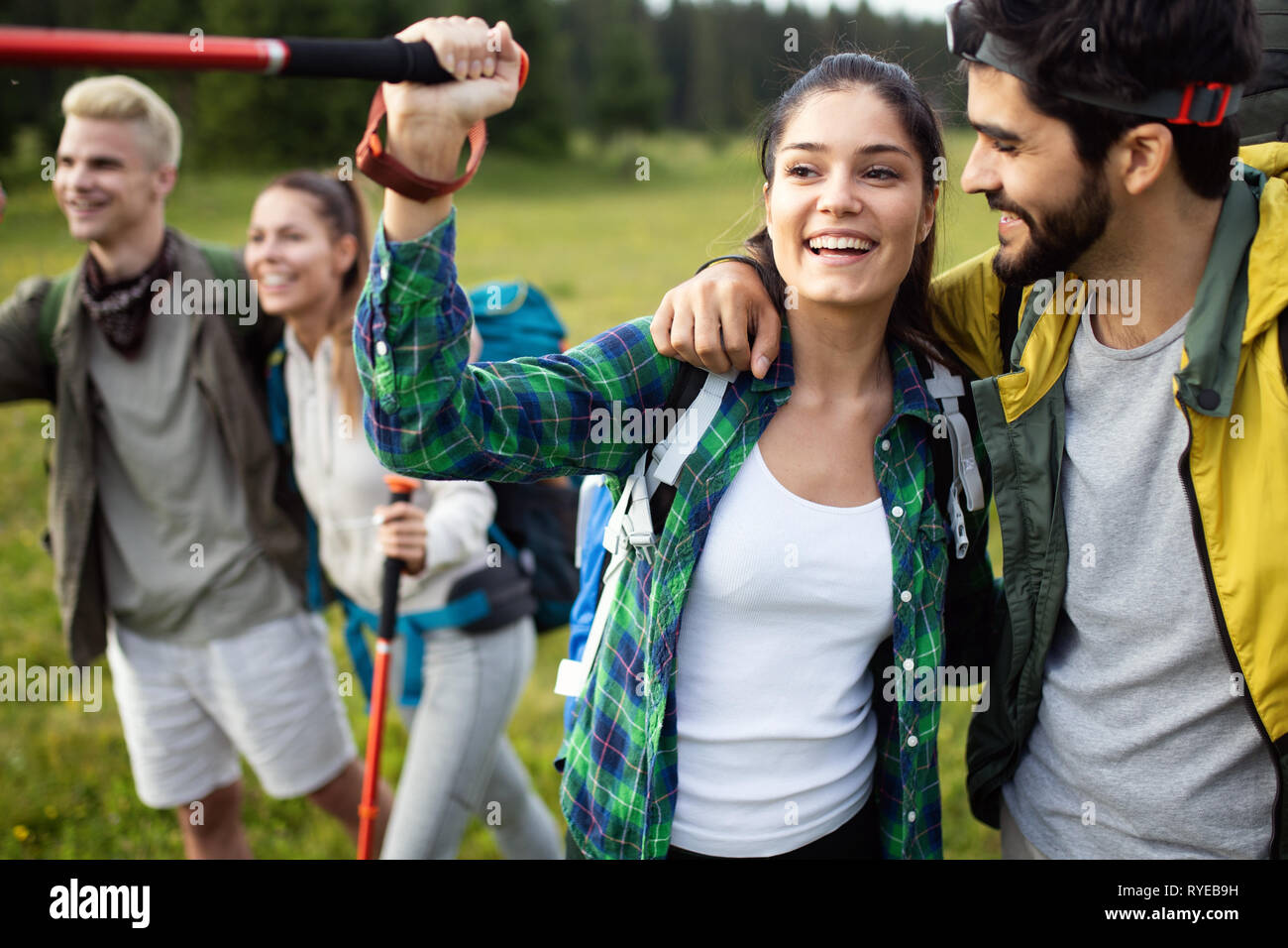 travel, tourism, hike, gesture and people concept - group of smiling ...