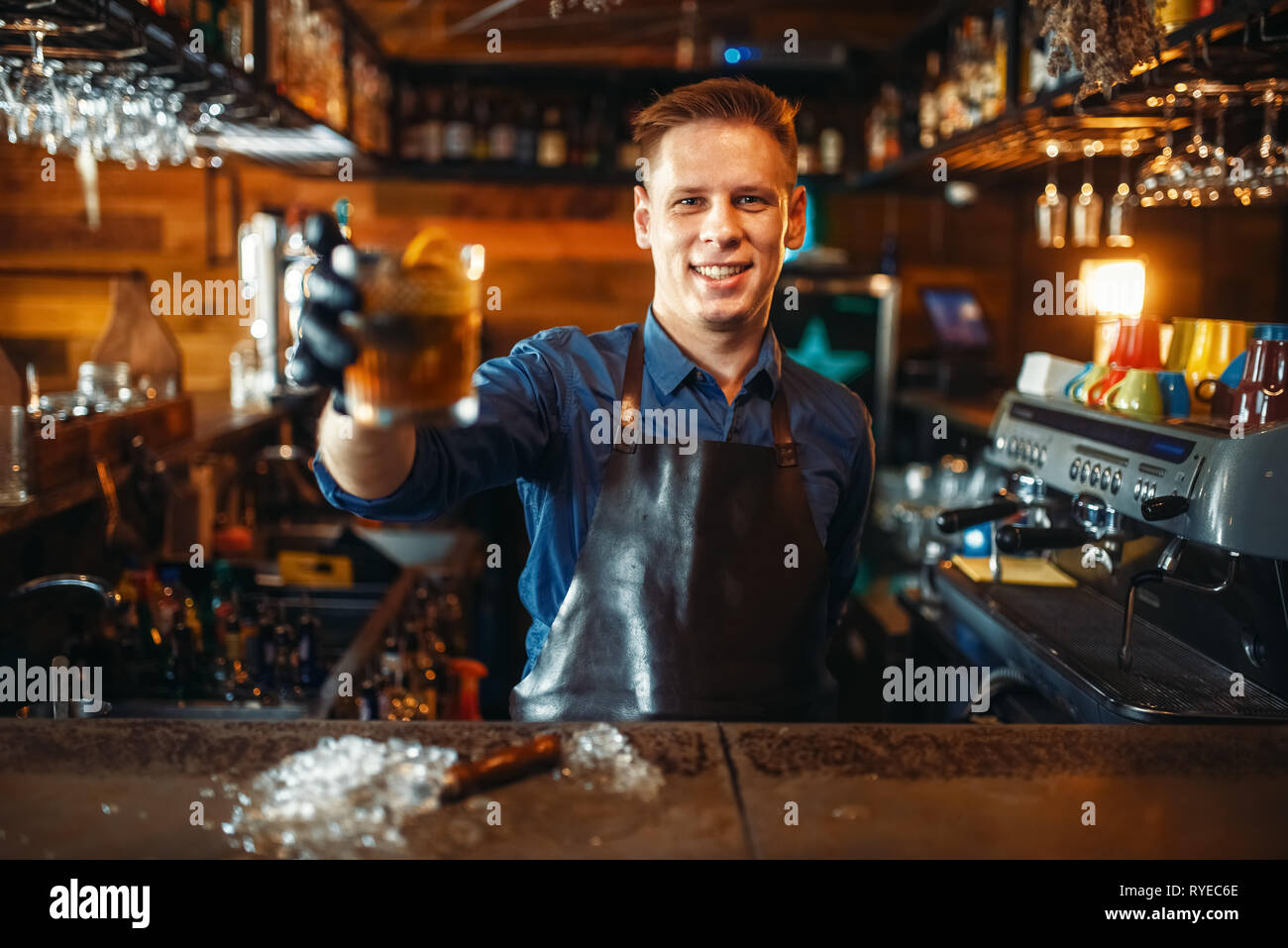 Male bartender tasting beverage at the bar counter Stock Photo Alamy