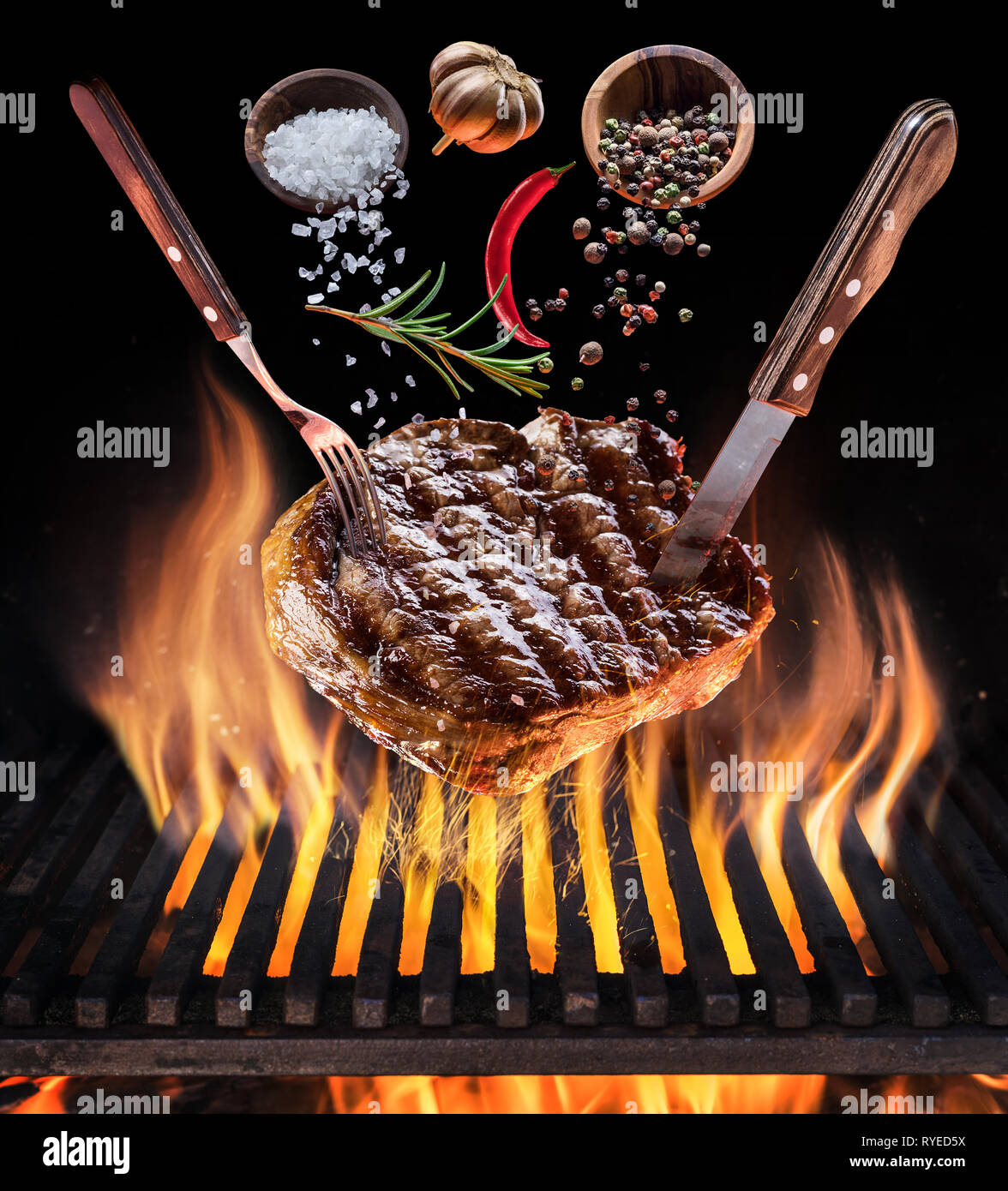 Steak ribeye cooking. Conceptual picture. Steak with spices and cutlery