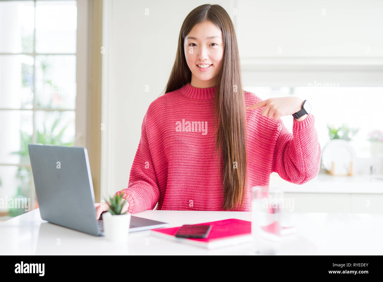 Beautiful Asian woman working using computer laptop with surprise face ...