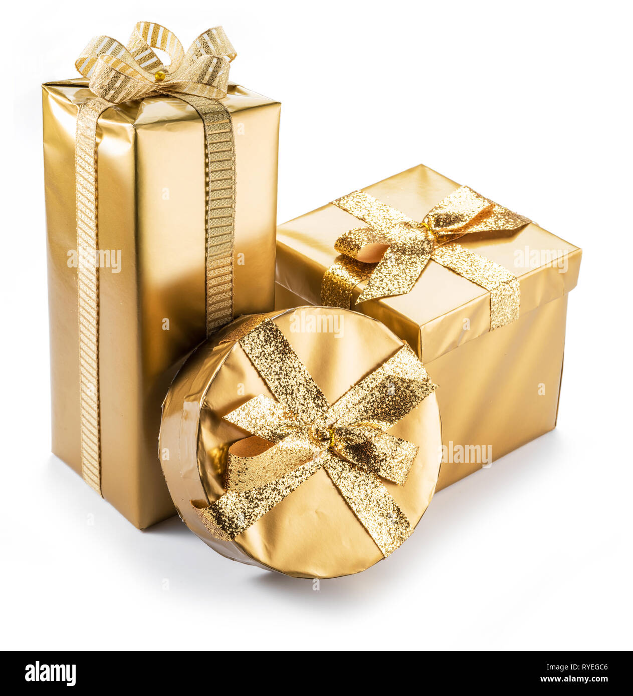 Golden gift boxes as a symbol of wishes and celebration on white