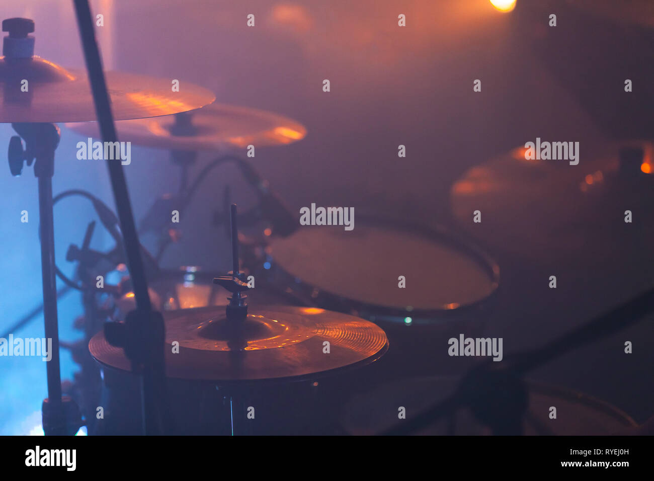 Live music photo background with rock drum set in stage lights. Close-up photo, soft selective focus Stock Photo