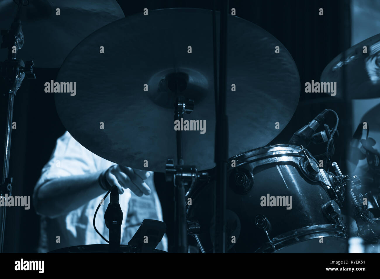 Live music photo, drum set with cymbals. Blue tonal filter effect Stock Photo