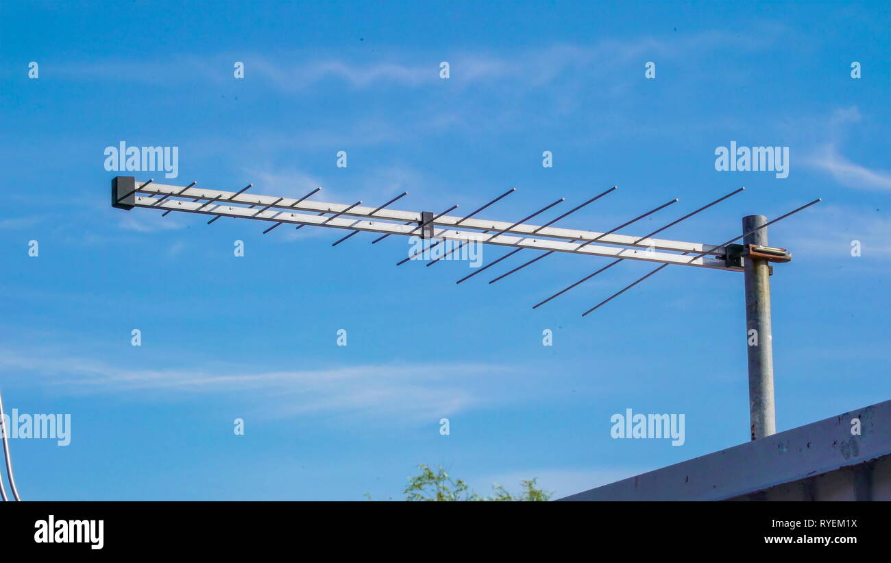 The satellite antenna on top of the house in the city used for
