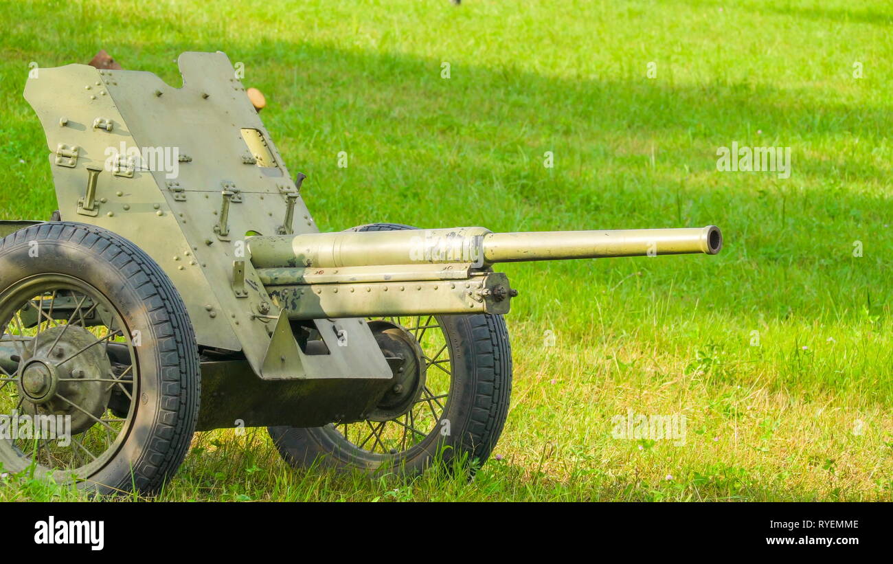 A small cannon on the grassy lawn in Valga Estonia during the celebration of the military festival during the WorldWar II Stock Photo