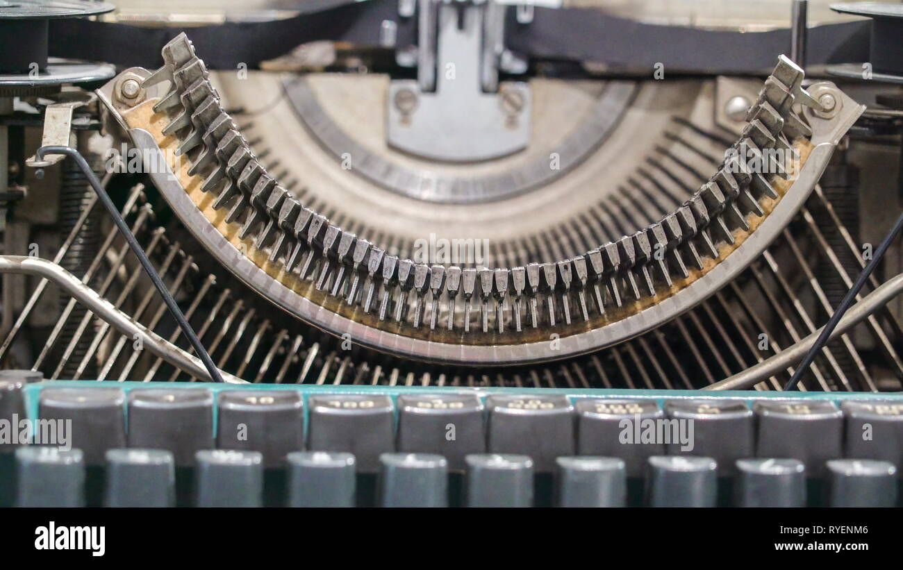 A much closer look of the typebars of the antique typewriter as one of the parts of the old typing machine Stock Photo