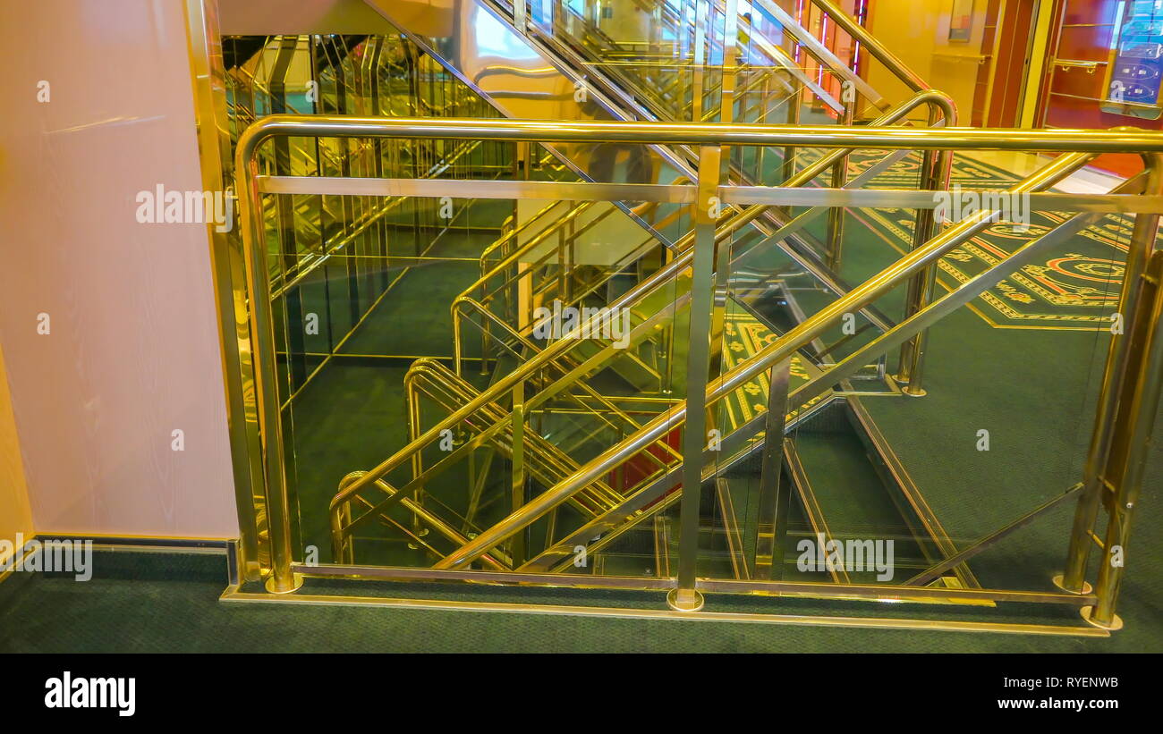 The small stairs with the metal railings inside the cruise ship with