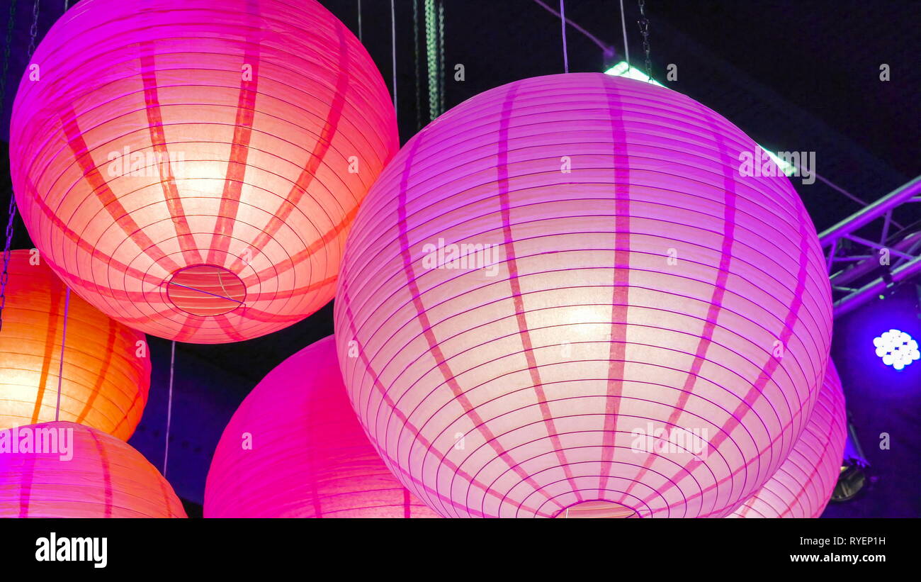 The Orange And Purple Color Hanging Balls On The Ceiling Of