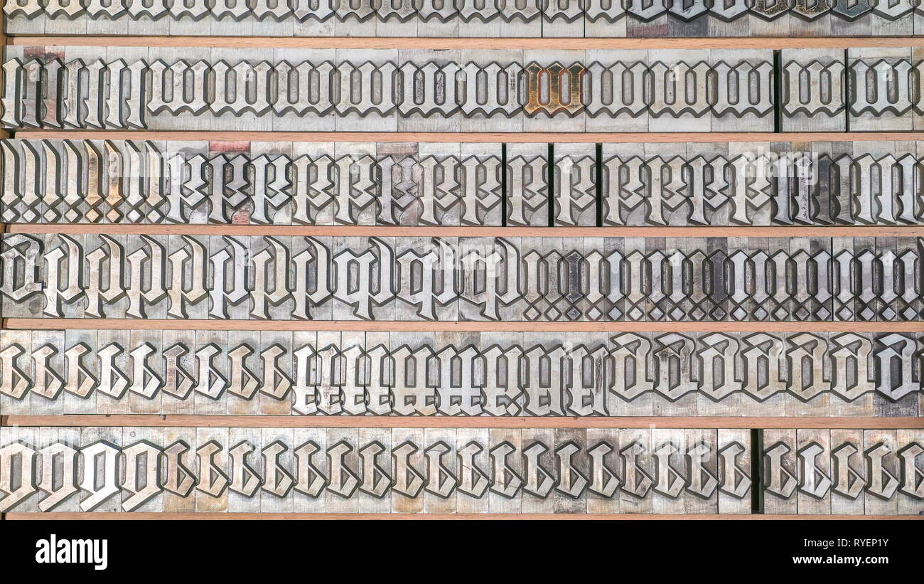 Lots of the letter stamps on the wall inside the old printing station to be used for printing canvass in the station Stock Photo