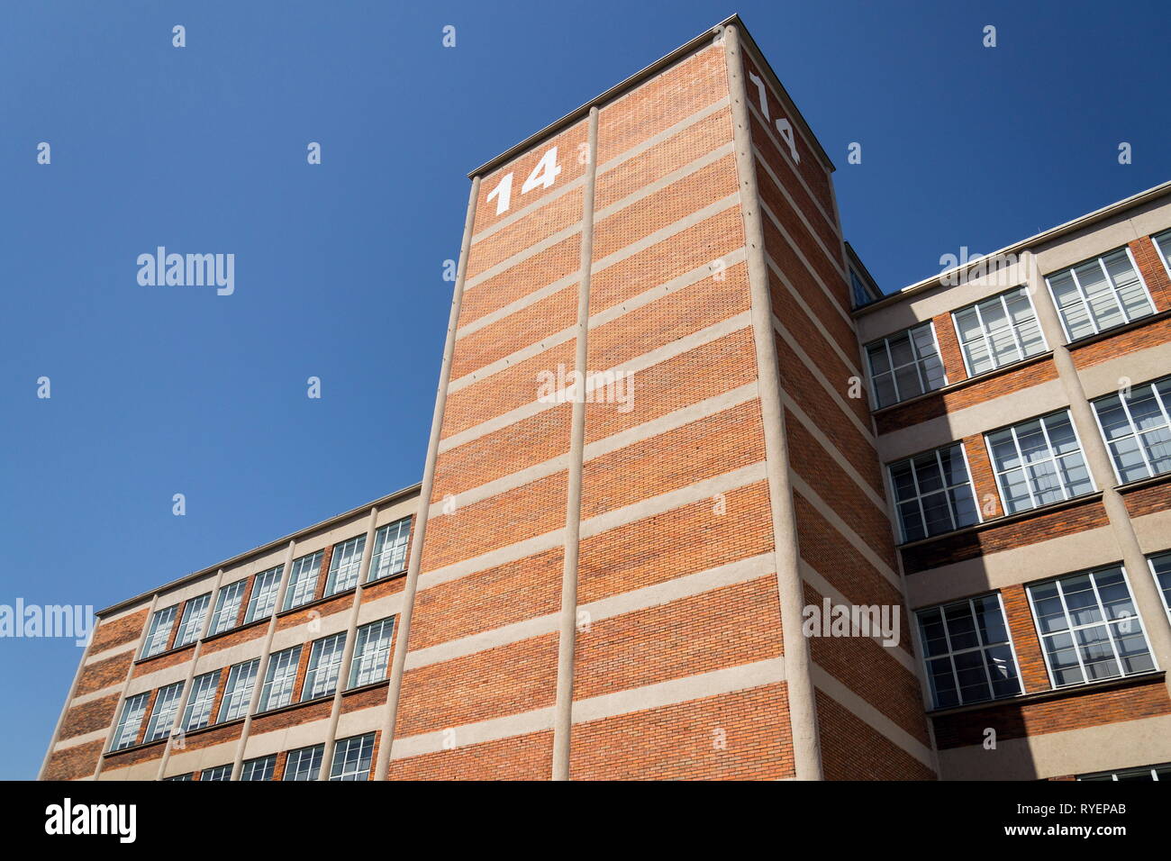 Traditional Zlin red brick building exterior, former shoe factory nowadays museum and gallery of Bata institute, Moravia, Czech Republic, sunny summer Stock Photo