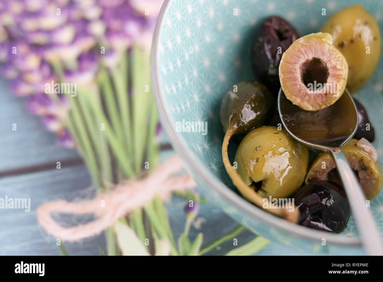 mixed olives on decorated table with copy space Stock Photo