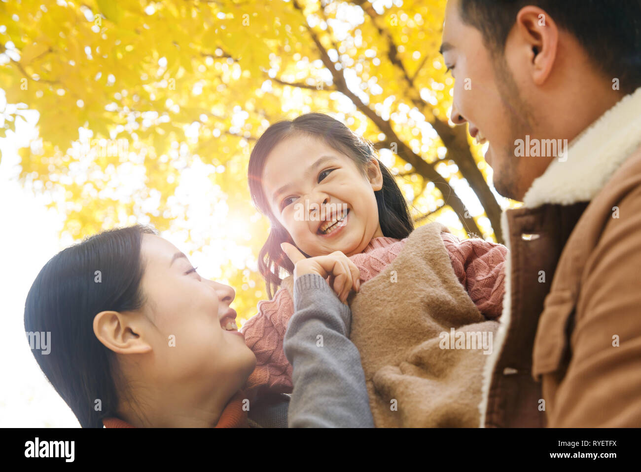 Three play outdoors Stock Photo - Alamy