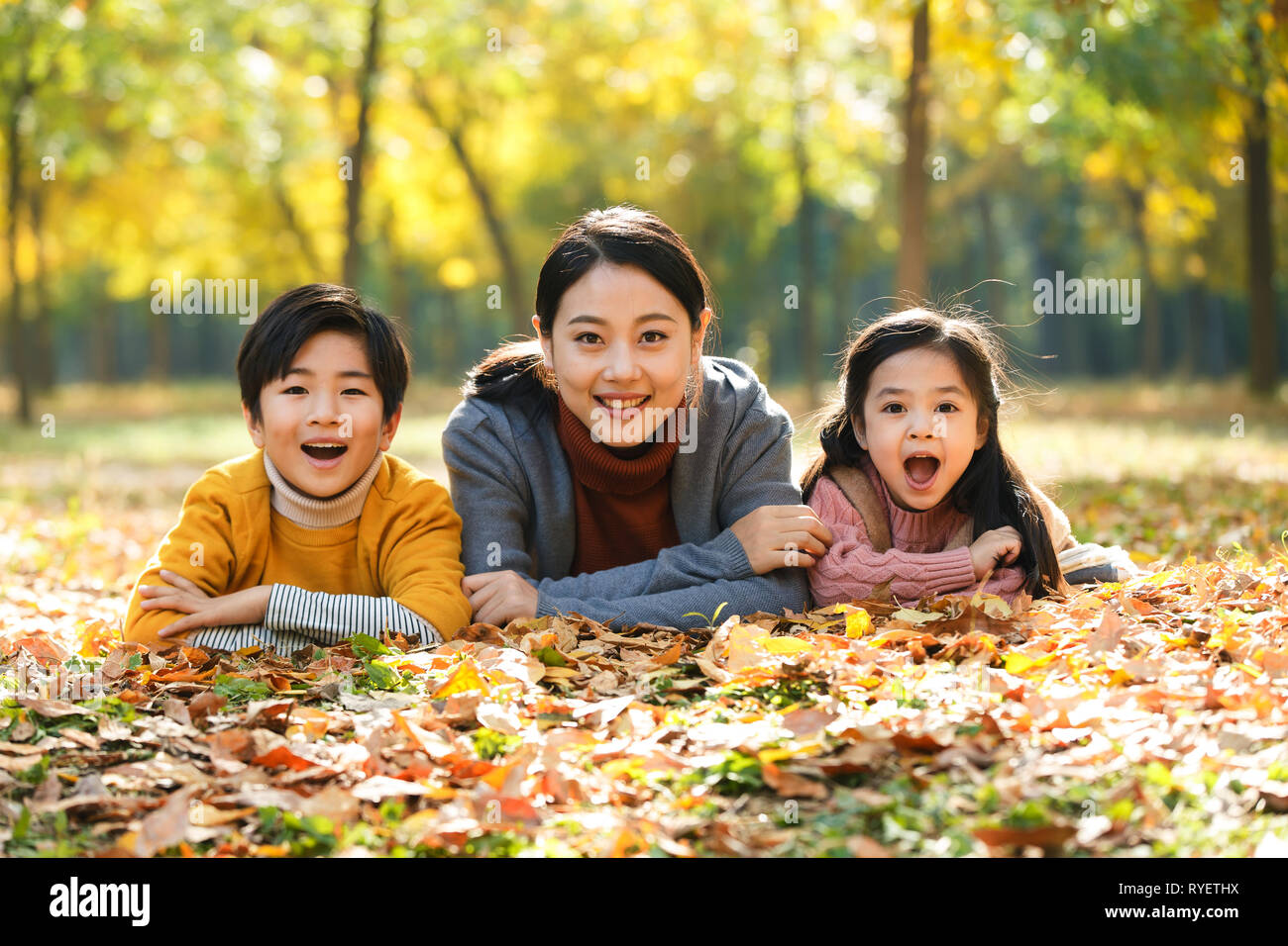 Mother and children play outdoors Stock Photo Alamy