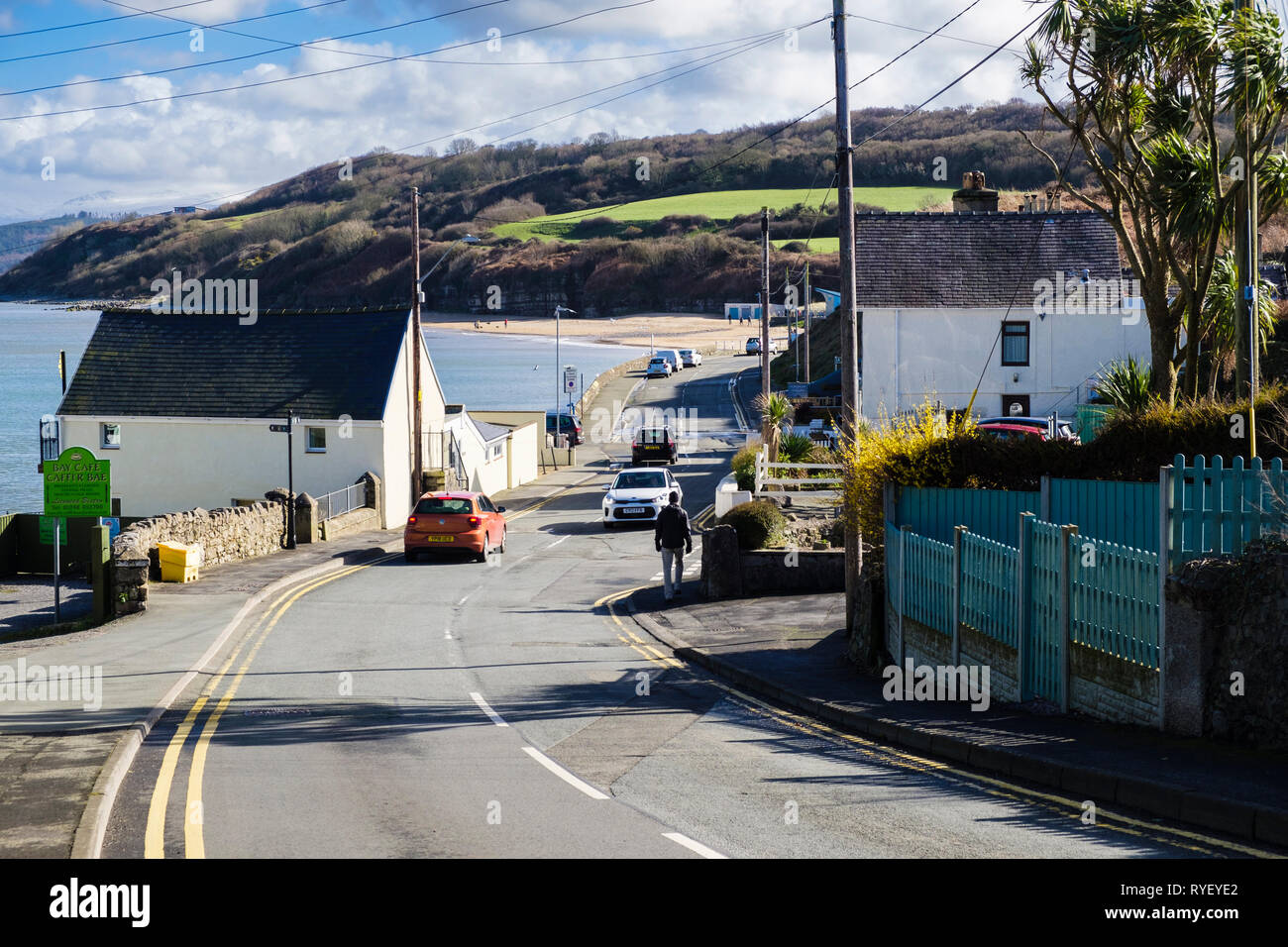 View down road to seafront and beach in village resort of Benllech
