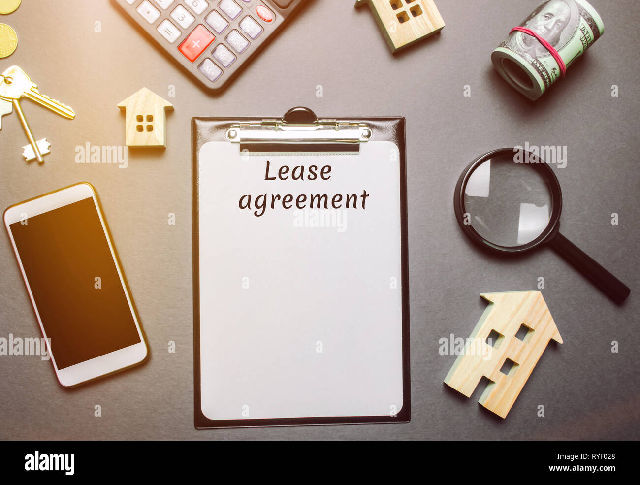 Table with wooden houses. Real estate. Lease agreement is a contract between a lessor and a