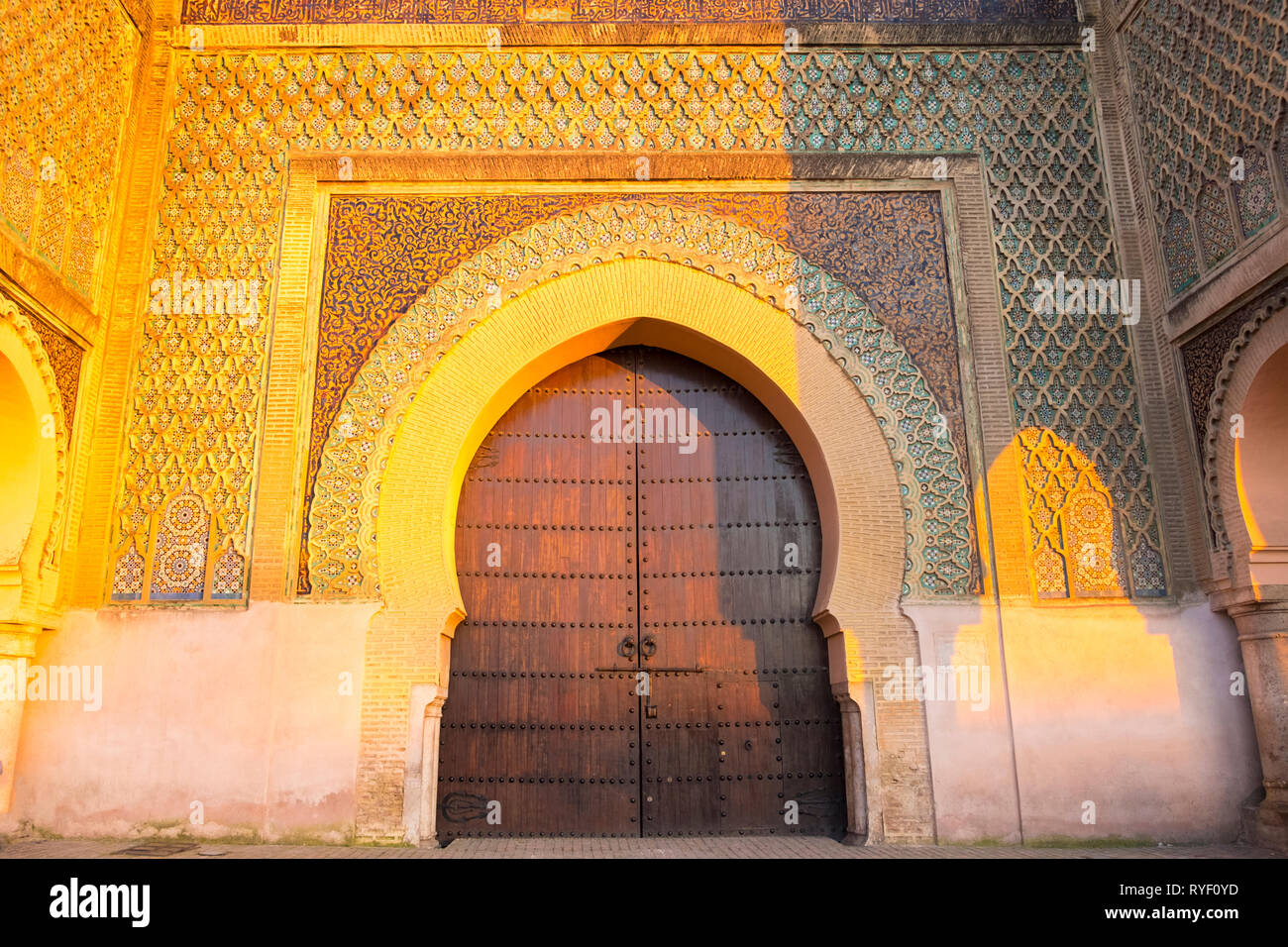 Golden hour at centered Bab al mansour gate in the old town medina of Meknes, Morocco. Horizontal Stock Photo