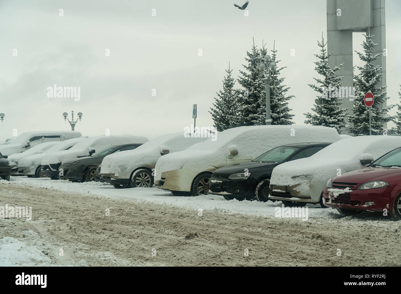 Cars under snow in Parking lot Stock Photo - Alamy