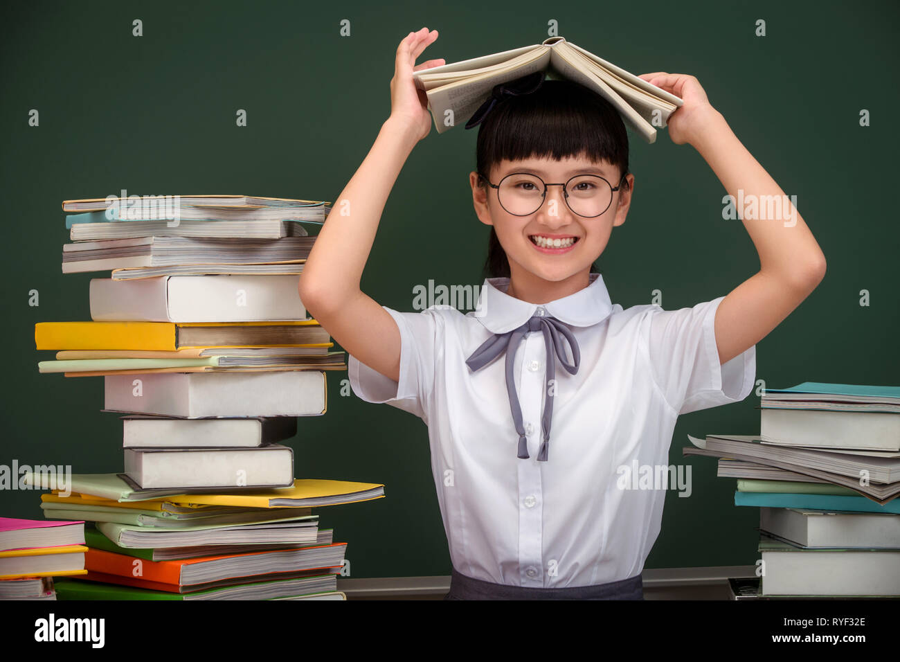 Indian school girls reading book hi-res stock photography and images ...