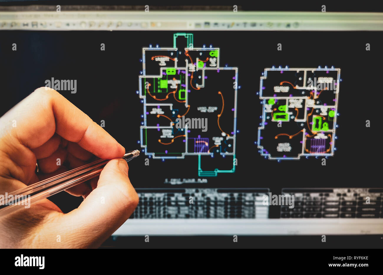 cad software drawing on the computer screen with hand holding pen Stock Photo