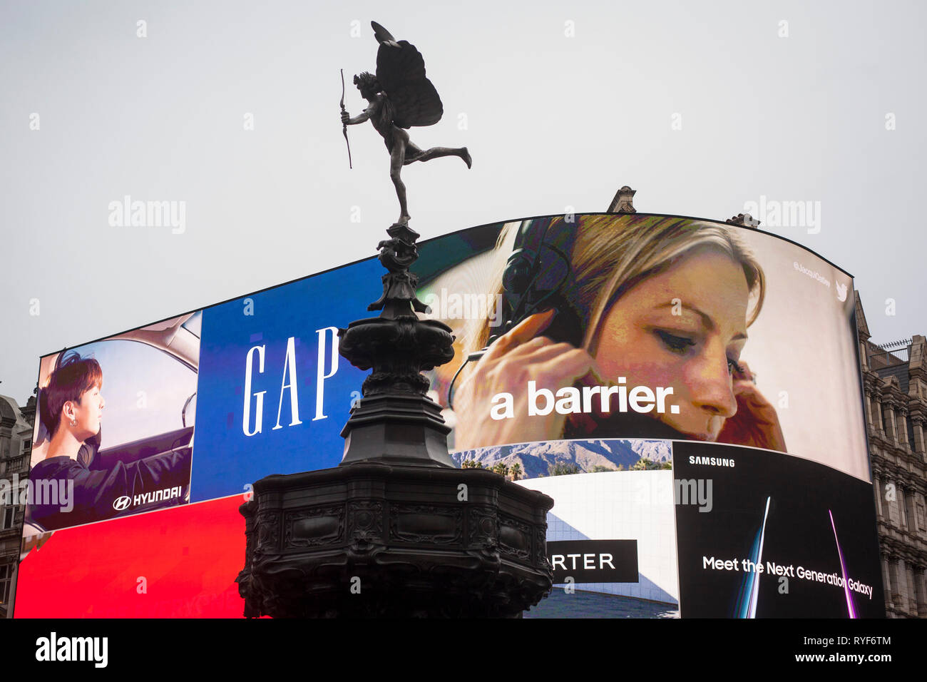 The Eros statue in Picadilly with the giant illuminated advertisng billboards behind. Stock Photo