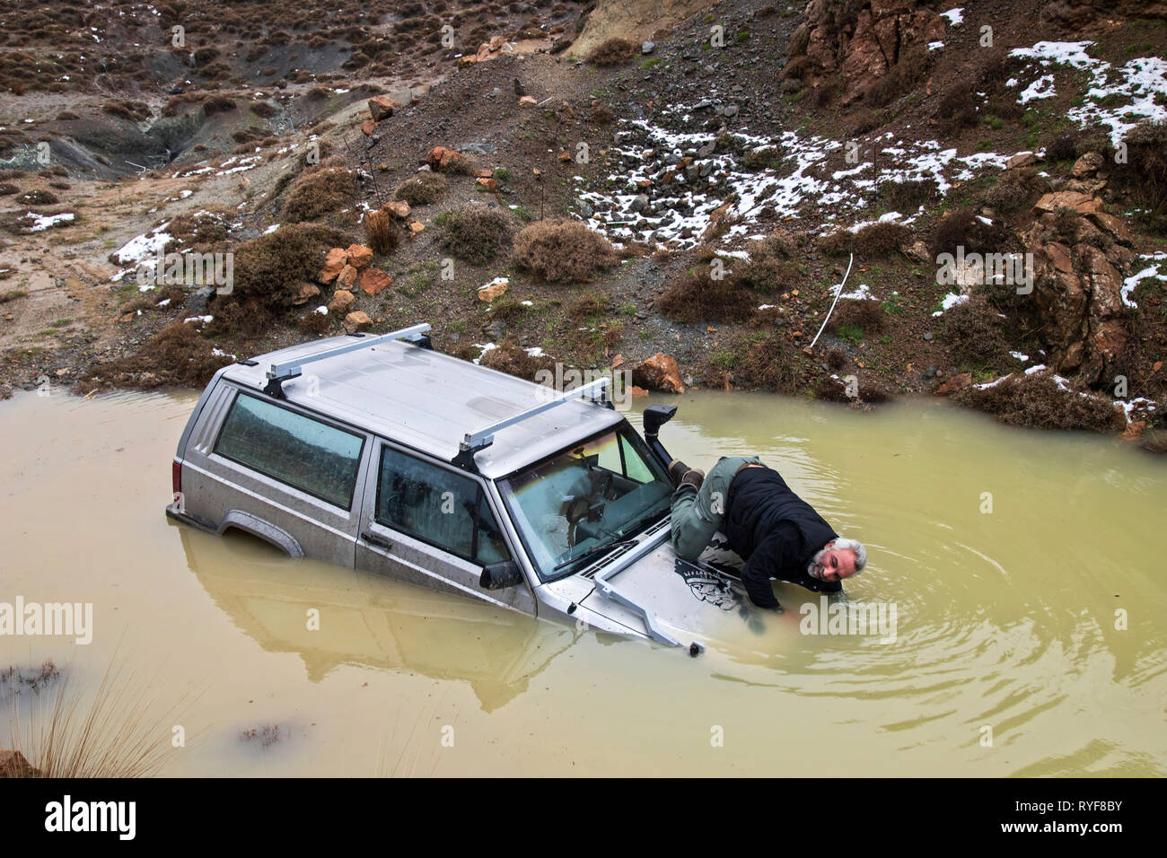 Off road adventure and car rescue at Katharo plateau, Lassithi, Crete, Greece. Stock Photo