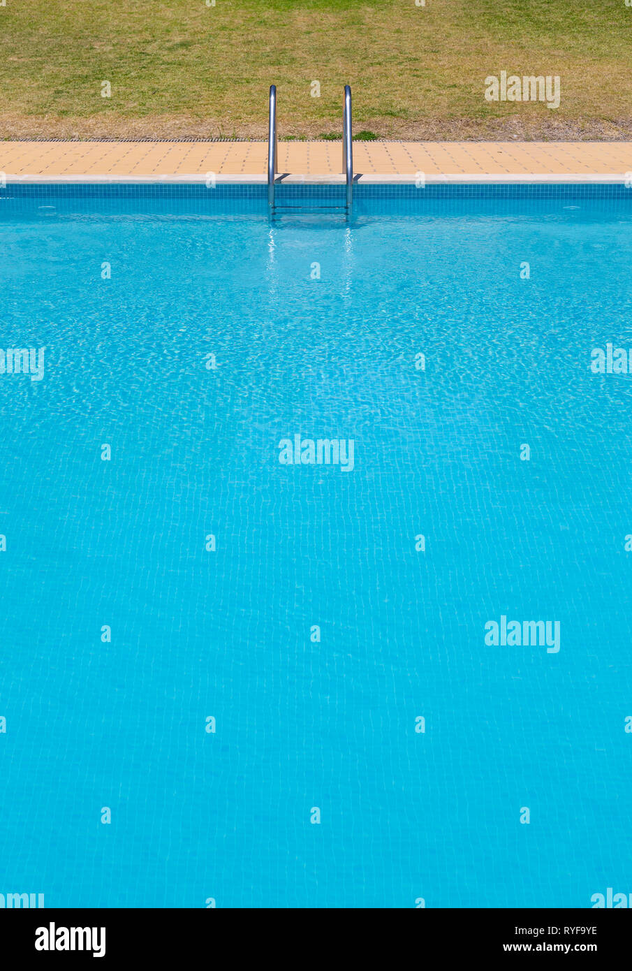 Image of a swimming pool with steps at the end and no people Stock Photo