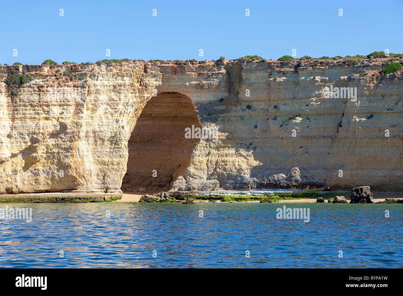 Large cave in the cliffs near Carvoeiro in Portugal Stock Photo