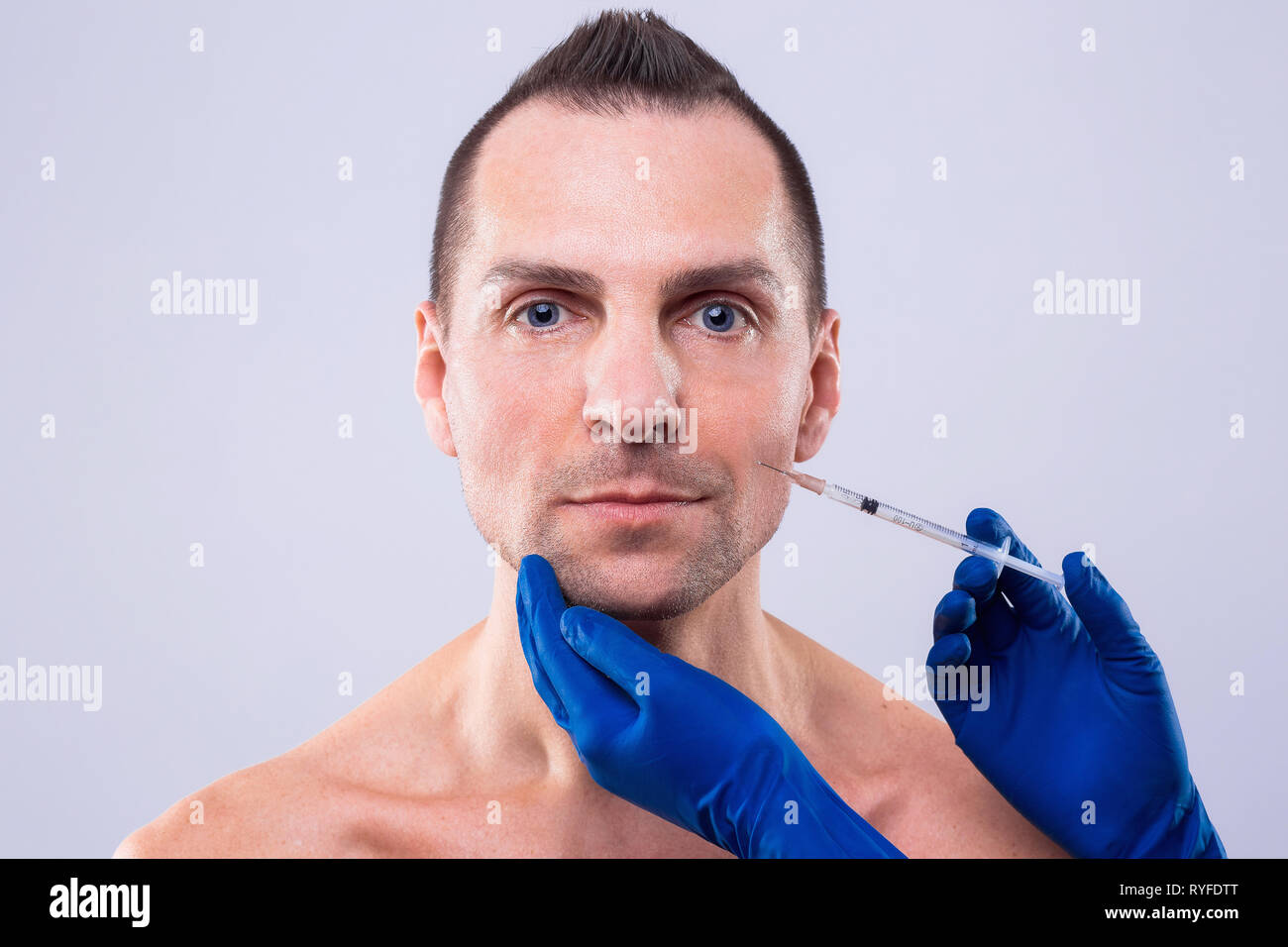 Botulinum Therapy. Close-up Of Person Hands Injecting Syringe With Botox For Face Treatment. ESTHETOX Stock Photo