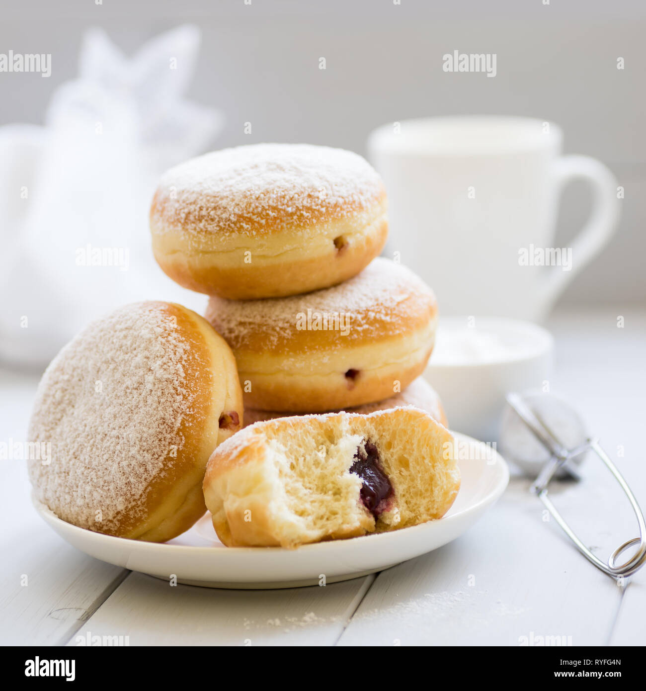 Traditional German Polish Donut with Raspberry Jam Dusted with Icing