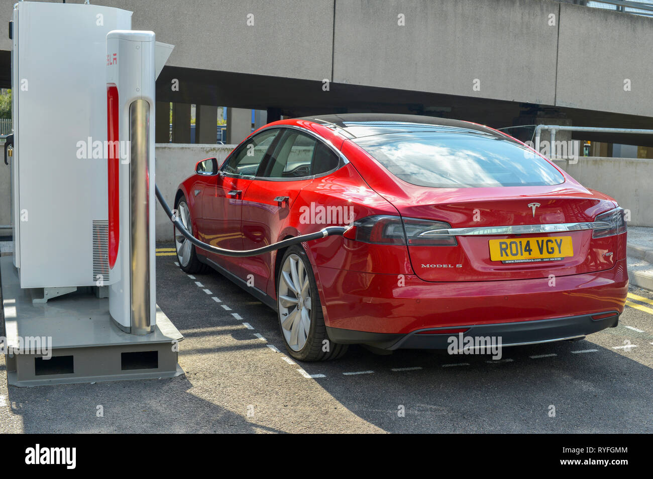 Tesla Model S electric car charging at a Supercharger station Stock Photo Alamy