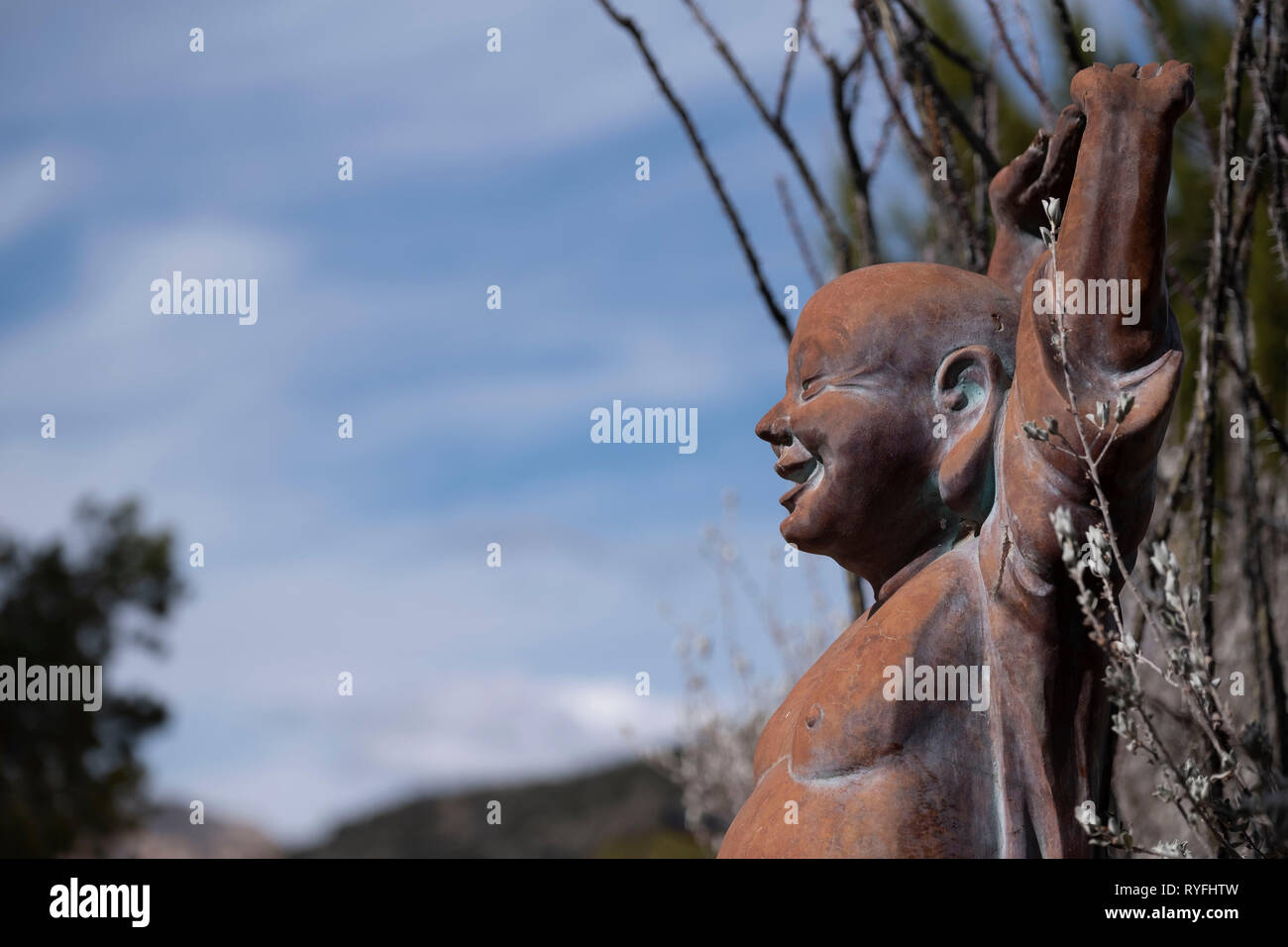 Smiling Buddha Statue Stock Photo