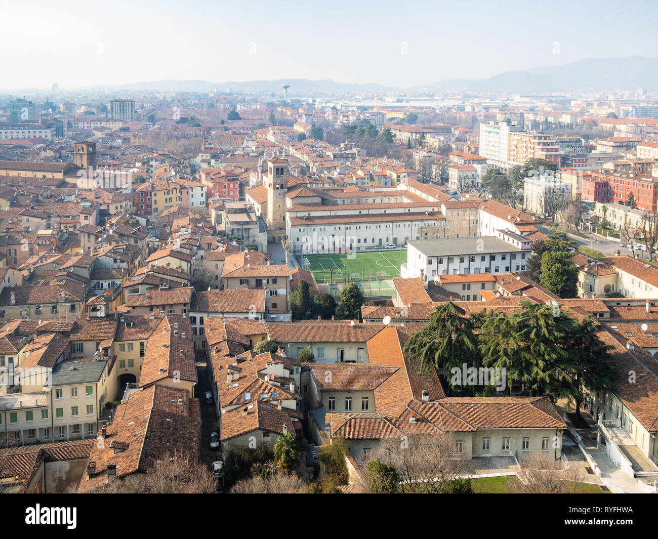Travel to Italy - aerial view of Brescia city with football stadium and churches Santuario di Santa Maria delle Grazie and Chiesa dei Santi Faustino e Stock Photo