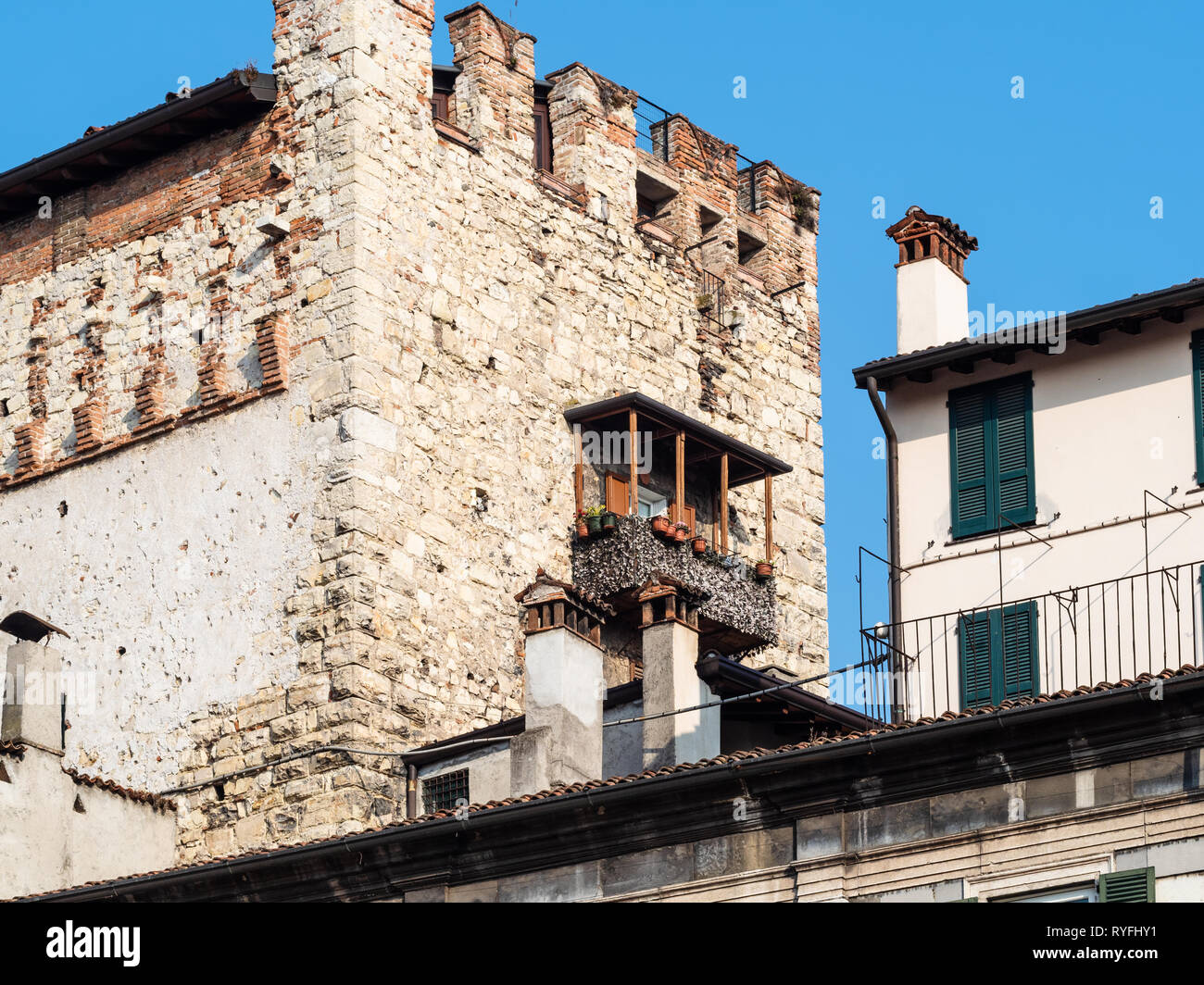 Travel to Italy - view of top of medieval tower Torre Bruciata from square Piazza Loggia in Brescia city, Lombardy Stock Photo