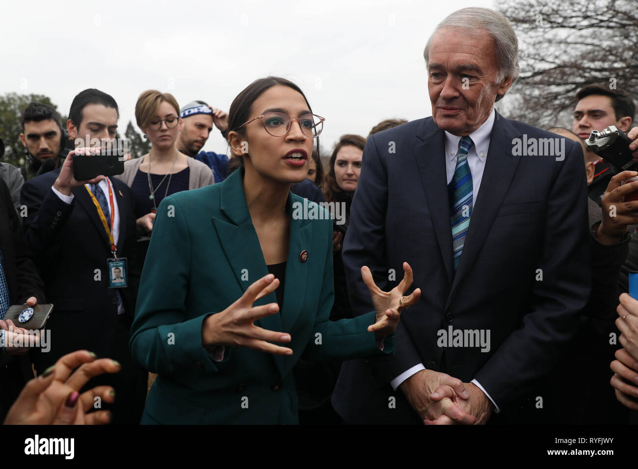 U.S. Rep. Alexandria Ocasio-Cortez, and Senator Ed Markey answers questions during the announcement for the Green New Deal legislation during a press conference outside the Capitol Building February 7, 2019 in Washington, D.C. Stock Photo